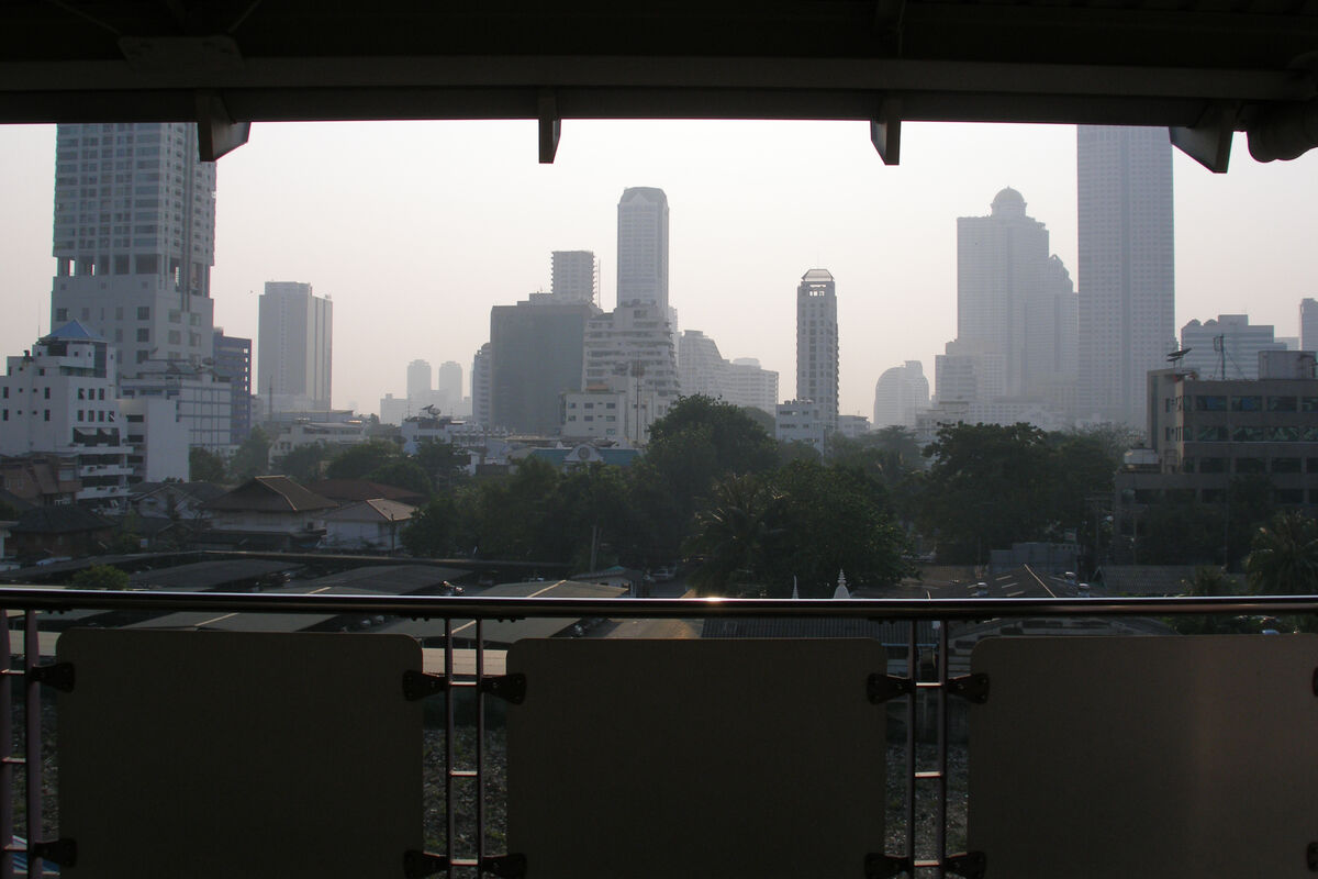 Bangkok skyline of luxury condominium towers and hotels, representing the high-end long-stay lifestyle Thailand Privilege (Thailand Elite) membership markets to foreigners planning to retire in Thailand or relocate for the long term.