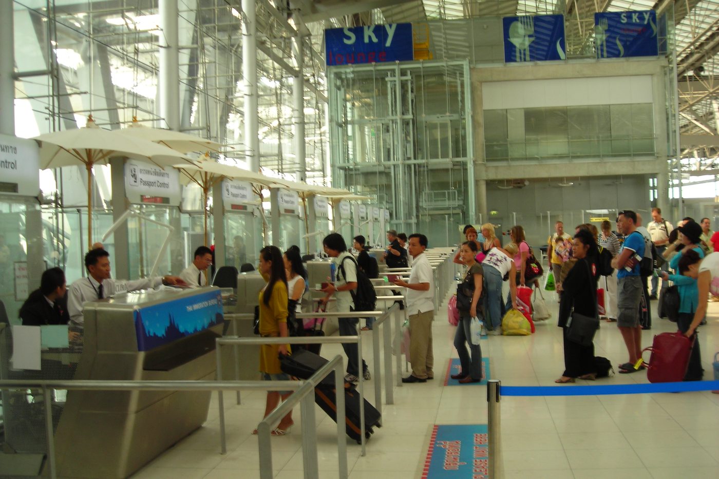 Passport control counters at Suvarnabhumi Airport in Bangkok, where Thailand's proposed 450-baht entry fee would be collected from most foreign arrivals under the current plan.