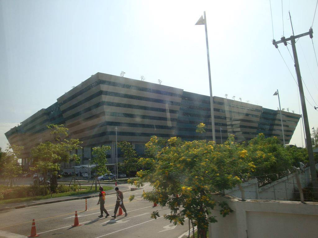 Front view of the Chaeng Watthana Government Complex in Bangkok where visitors queue for Thai visa and immigration services.