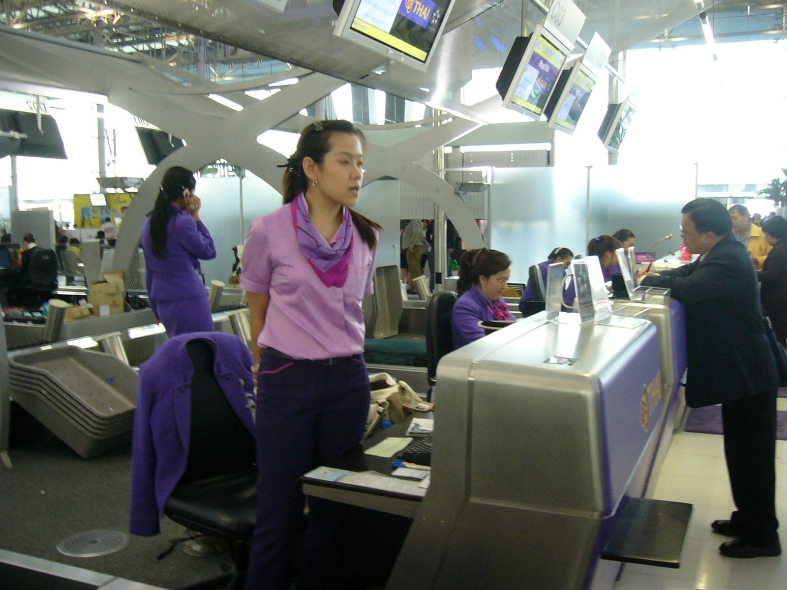 Check-in counters at Suvarnabhumi Airport in Bangkok, where a proposed 450-baht fee could be added to airline tickets, a key point in Thailand expat news for 2027.