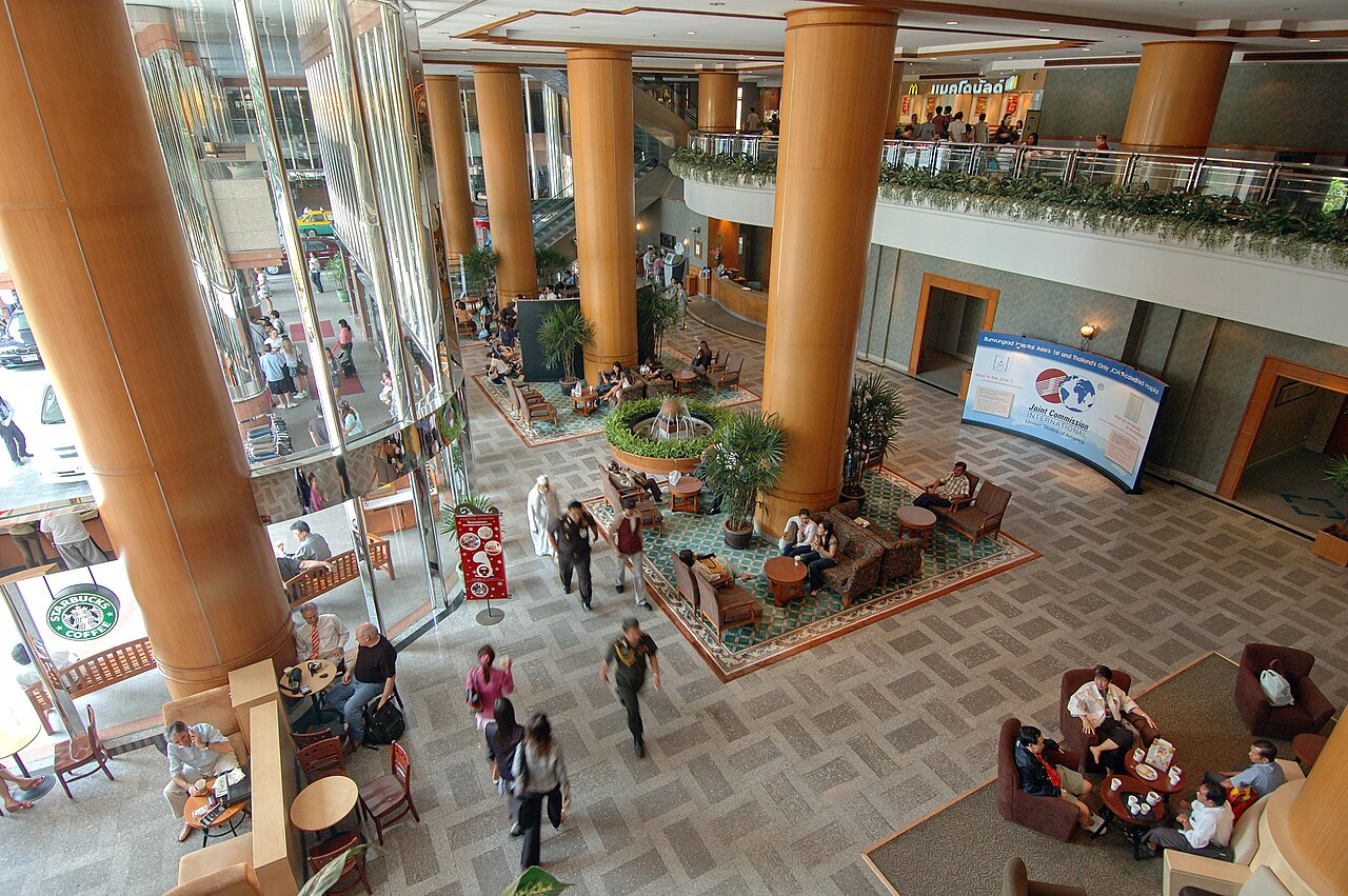 Interior lobby of Bumrungrad International Hospital in Bangkok, Thailand, where expats living in Thailand check in and where Thailand healthcare for foreigners insurance paperwork starts